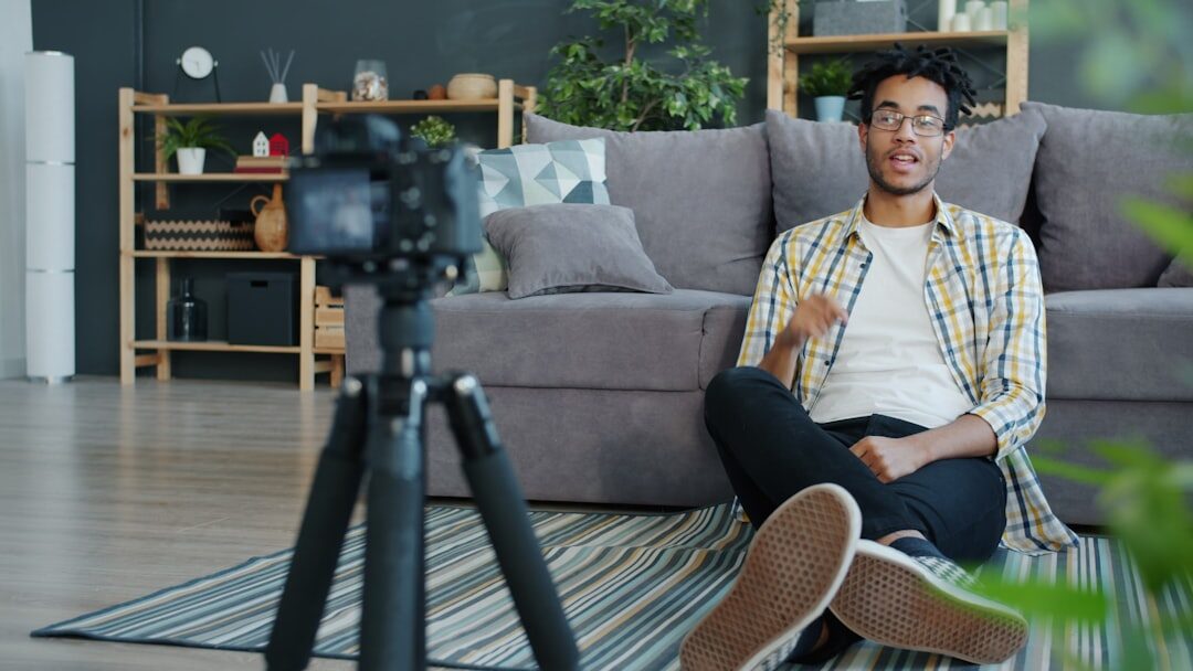 Person speaking in front of camera in media studio